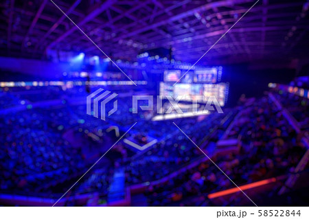 Blurred background of an esports event - The winner of tournament team on a stage with a cup award 58522844