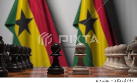 Chess game against flags of Ghana. Political competition related 3D rendering 58523747