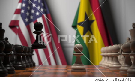 Flags of USA and Ghana behind pawns on the chessboard. Chess game or political rivalry related 3D Flags of USA and Ghana behind pawns on the chessboard. Chess game or political rivalry related 3D 58523749