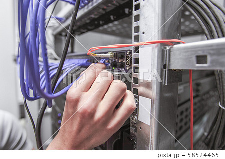 Engeneer in network server room 58524465
