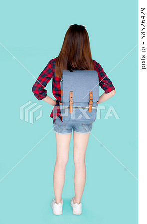 Back view of beautiful young asian woman travel with backpack isolated on blue background Back view of beautiful young asian woman travel with backpack isolated on blue background 58526429