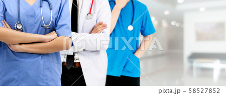 Doctor working in hospital with other doctors. Doctor working in hospital with other doctors. 58527852