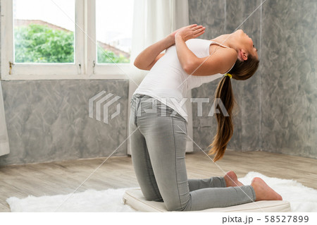 Young woman yoga on carpet at home living room. Young woman yoga on carpet at home living room. 58527899