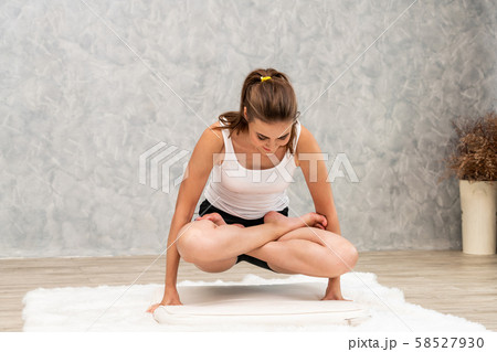 Young woman yoga on carpet at home living room. Young woman yoga on carpet at home living room. 58527930