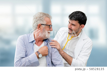 Doctor checking patient health in hospital office. 58528135