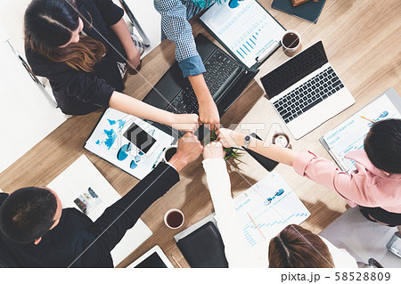 Teamwork business people join hands in meeting. Teamwork business people join hands in meeting. 58528809