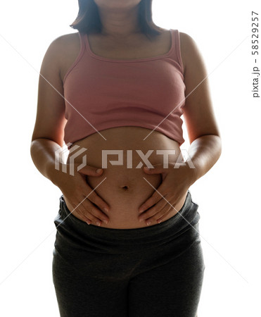 Happy pregnant woman isolated on white background. 58529257