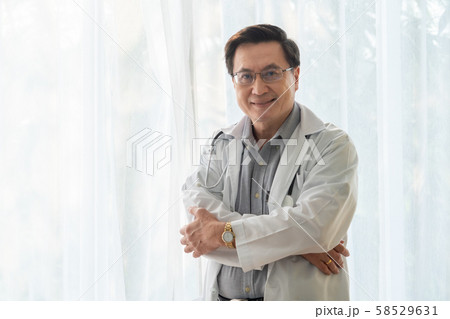 Senior male doctor working at the hospital. Senior male doctor working at the hospital. 58529631