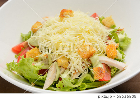 Chicken salad with cheese and crackers on the white dish. Closeup 58536809