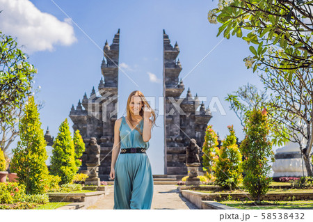 Young woman tourist in budhist temple Brahma Vihara Arama Banjar Bali, Indonesia 58538432