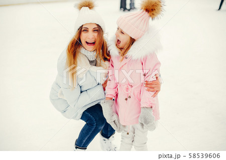 Cute and beautiful family in a winter city 58539606