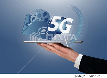 Man holding a digital tablet with symbol of 5G network for next generation video services. Man holding a digital tablet with symbol of 5G network for next generation video services. 58540426