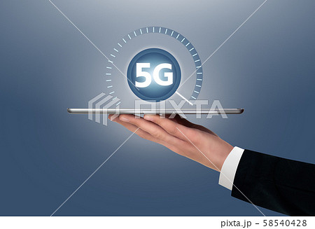 Man holding a digital tablet with symbol of 5G network connection.  58540428