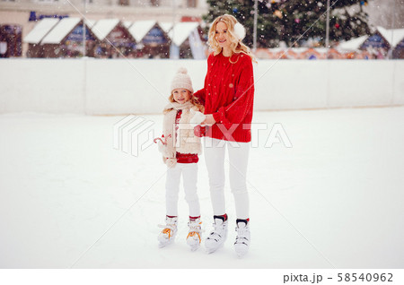 Cute and beautiful family in a winter city 58540962