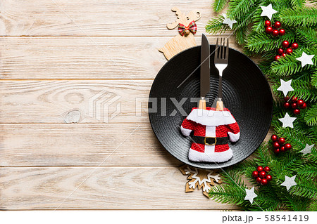 Top view of Christmas dinner on wooden background. 58541419