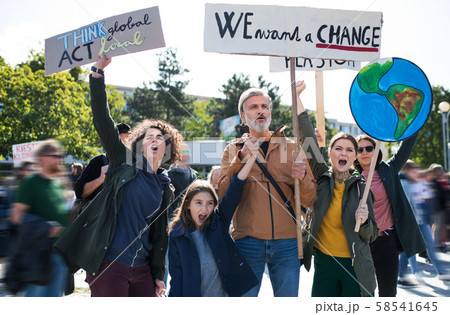 People with placards and posters on global strike for climate change, shouting. 58541645