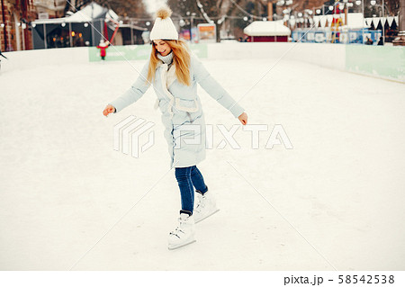 Cute and beautiful girl in a winter city Cute and beautiful girl in a winter city 58542538