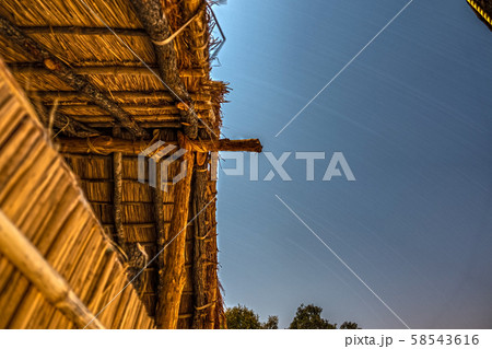 Night long exposure under wooden hut, bottom view Night long exposure under wooden hut, bottom view 58543616