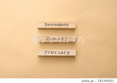 Wooden calendar winter months on wooden cubes. Top view Flat Lay Minimal 58546001