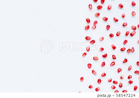 Pomegranate seeds on white background. 58547224