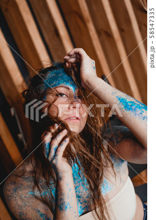 Portrait of beautiful woman with sparkles on her face. Girl with art make up 58547335