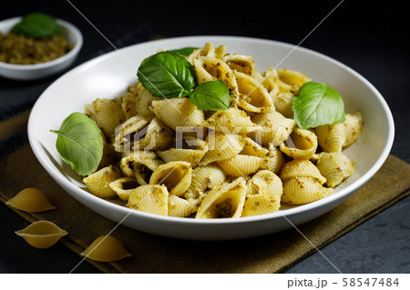 Conchiglie pasta with pesto sauce Conchiglie pasta with pesto sauce 58547484