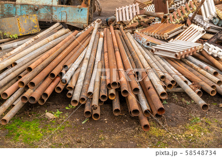 Scrap metal waste is stored in a recycling yard 58548734