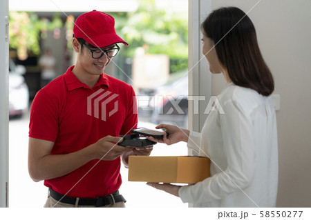 home delivery service man in red uniform 58550277