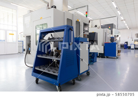 Row of equipment producing metal parts in works Row of equipment producing metal parts in works 58550705