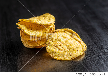 Round nacho chips. Yellow tortilla chips 58555751