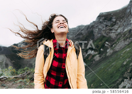 Beautiful caucasian hipster girl with long curly 58556416