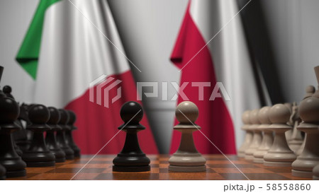 Flags of Italy and Poland behind pawns on the chessboard. Chess game or political rivalry related 3D 58558860