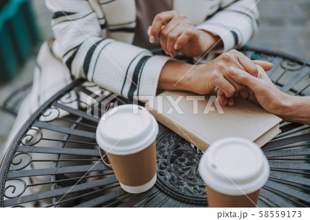 Two female friends holding each others hand 58559173