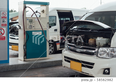 Petrol station or Gas station and passenger van Petrol station or Gas station and passenger van 58562982