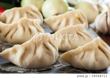 Raw gyoza or jiaozi dumplings ready for cooking Raw gyoza or jiaozi dumplings ready for cooking 58568711