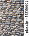 Stone Wall Made Of Round Stones 58569901