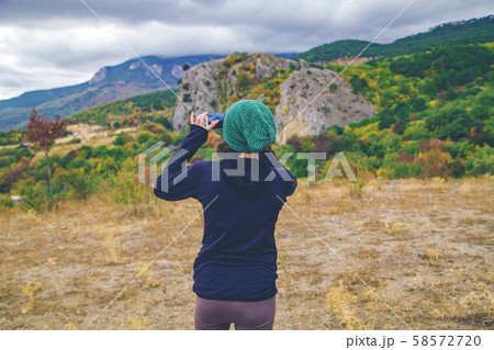 Woman take outdoor photo. 58572720
