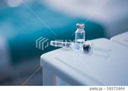 Vaccine vial dose flu shot drug needle syringe,medical concept vaccination hypodermic injection treatment disease care hospital prevention immunization illness disease  baby child.blue background  58572904