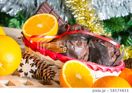 Christmas still life. Close up maffins, oranges and chocolate 58574833