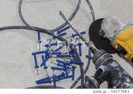 a hammer and a pile of construction dowels on the a hammer and a pile of construction dowels on the 58577661