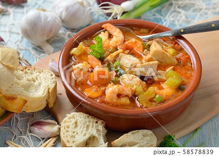 Mediterranean fish soup served with fresh white bread Mediterranean fish soup served with fresh white bread 58578839