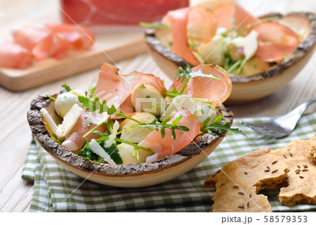 South Tyrolean salad with bacon, mozzarella pearls and rocket, served with crunchy local rye bread 58579353
