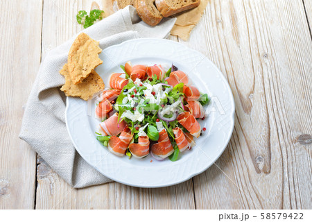 Salad plate with South Tyrolean bacon, served with parmesan cheese and rye bread Salad plate with South Tyrolean bacon, served with parmesan cheese and rye bread 58579422
