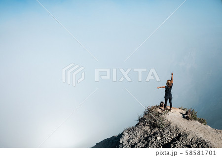Woman in protective mask on active volcano Kawah 58581701