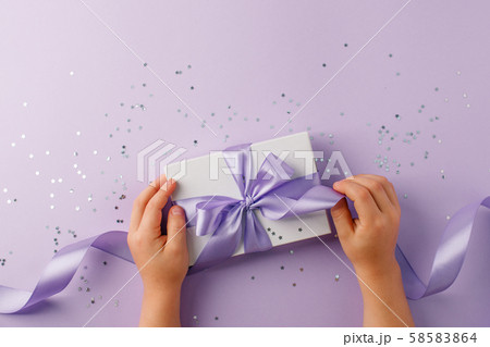 Christmas present stylish gift box in kids hands 58583864