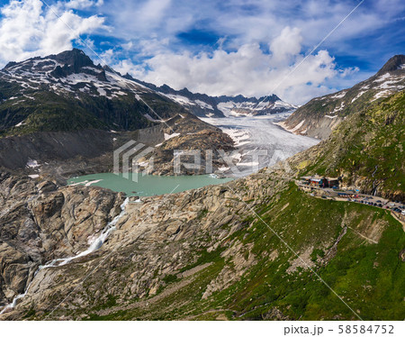 Aerial view of the melting Rhone glacier and the glacial lake in the Swiss Alps 58584752