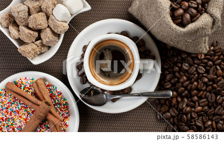 cup with black coffee on table in coffee house 58586143