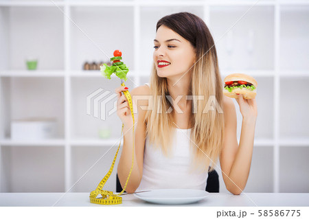 Choose between junk food versus healthy diet Choose between junk food versus healthy diet 58586775
