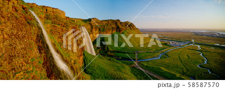 Beautiful Seljalandsfoss waterfall in Iceland during Sunset. 58587570