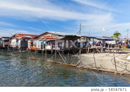 Old wooden houses and footbridges on stilts 58587671